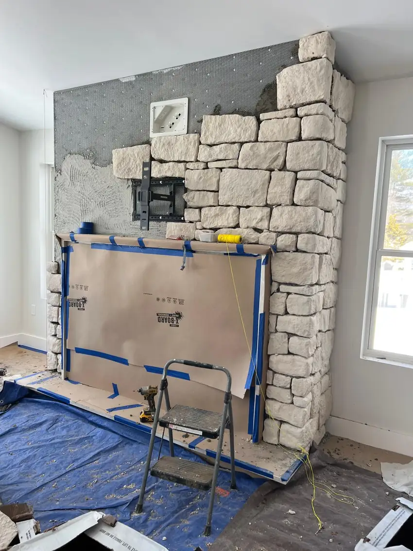 Interior stone fireplace surround during installation