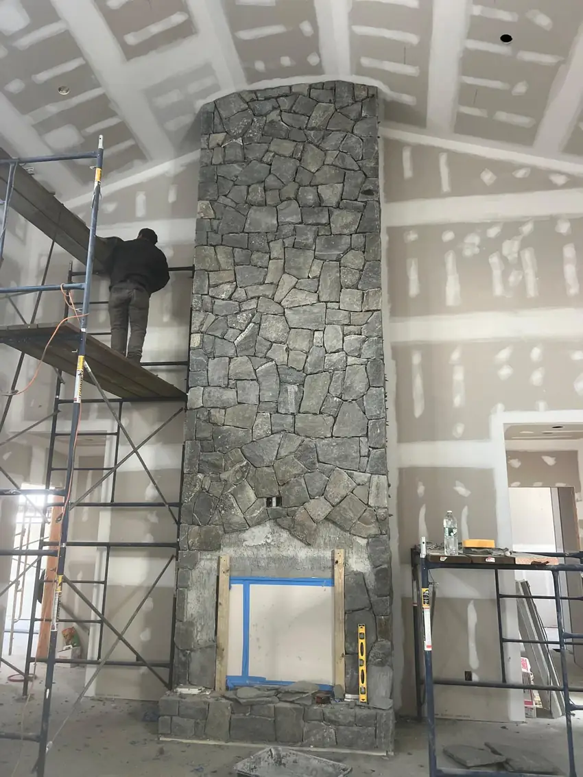 Stone fireplace surround during installation